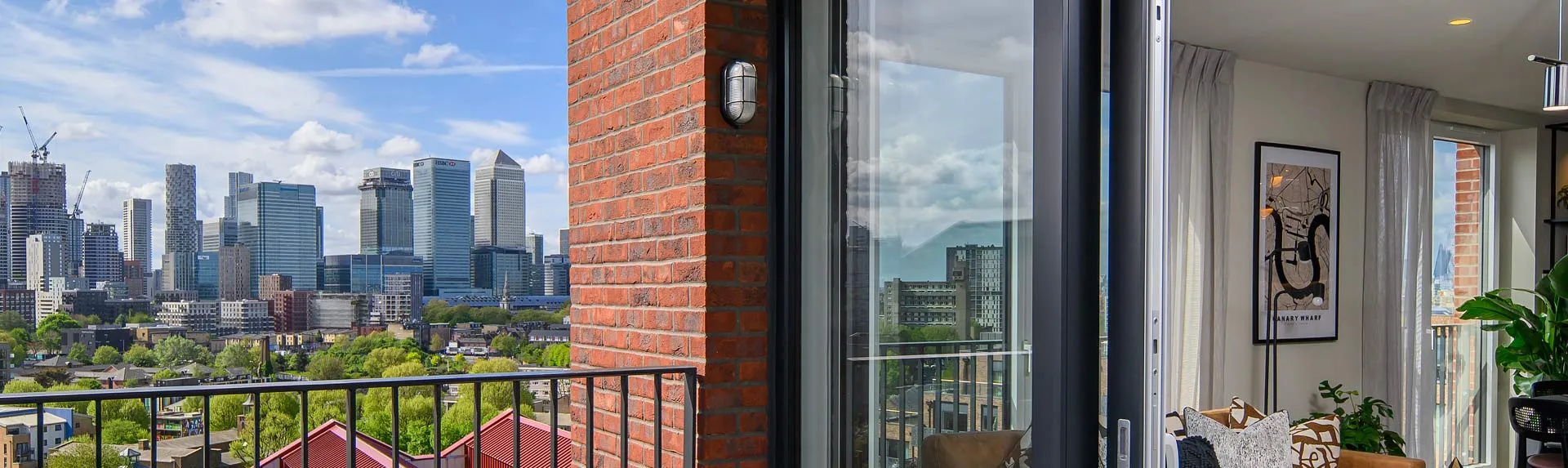 Balcony view from Heron Wharf overlooking the London skyline