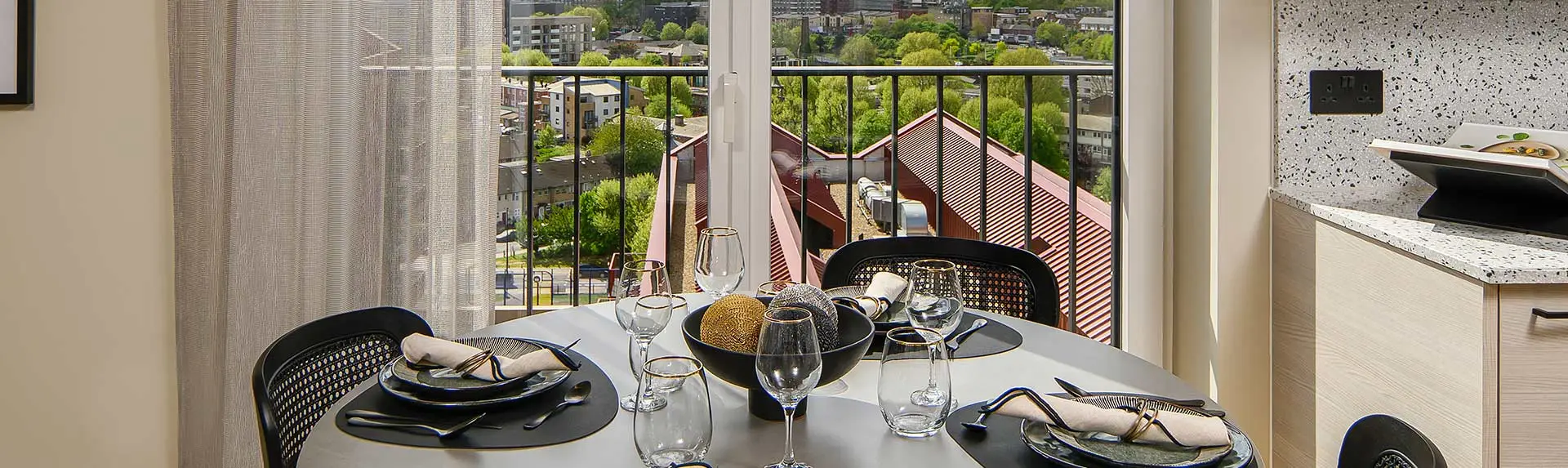 Stylish dining area at Heron Wharf with a bright window view